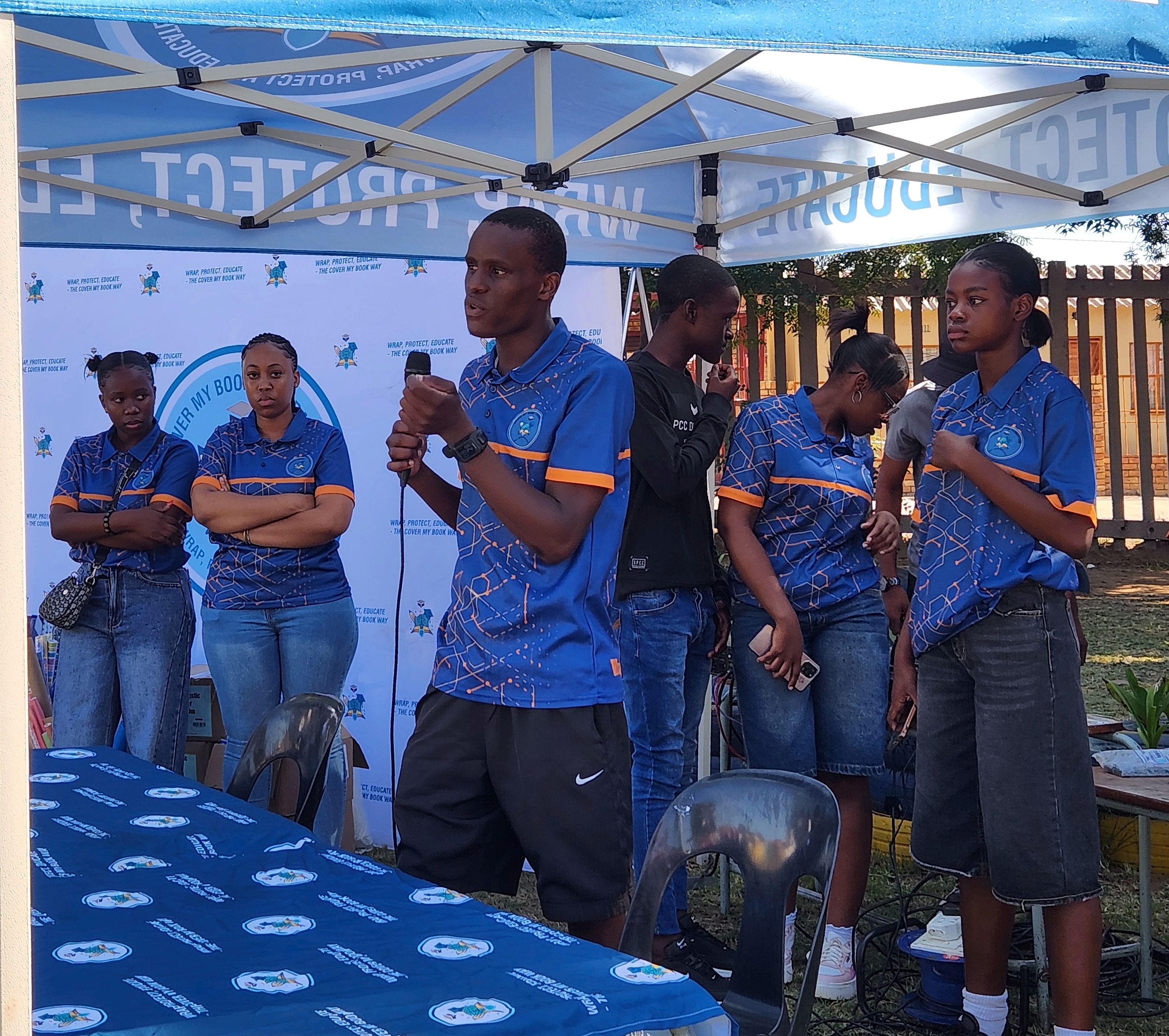 Scores of learners show up to get their books covered